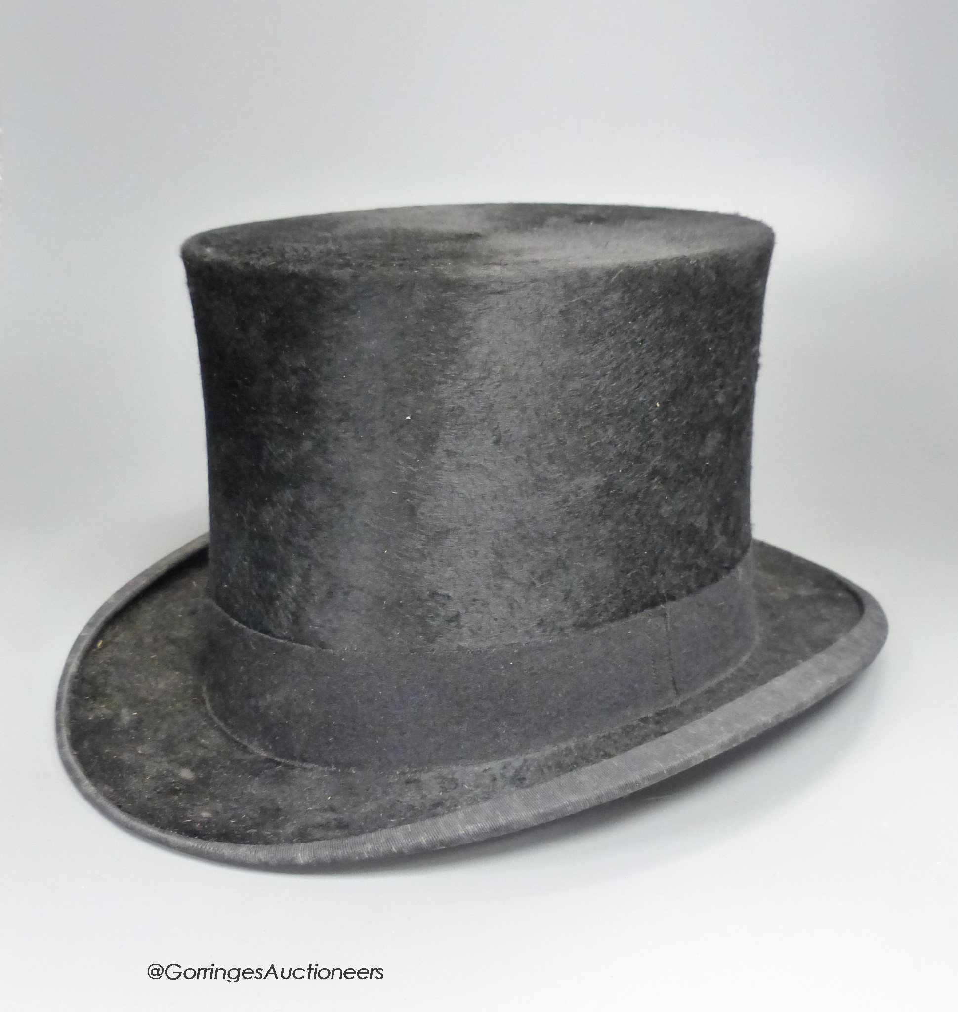 A Cuthbertson of London black silk top hat